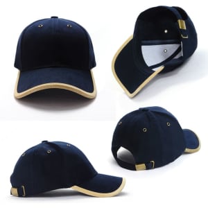 A navy blue cap with suede trim, featuring a logo and an adjustable strap at the back.