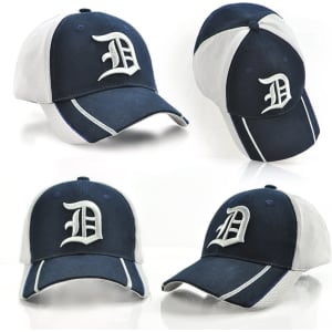 A navy and grey cap featuring a logo, showcasing multiple angles of the headwear design.