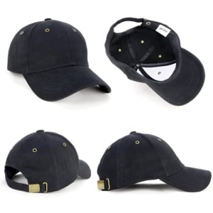 A black cap with a brass buckle and ventilation holes, featuring a logo on the inner side.