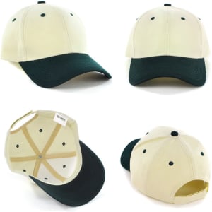 A two-tone cap in cream and dark green, featuring a curved brim and a logo on the front.