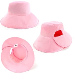 A pink bucket hat featuring a wide brim and a logo, with an open design showing the interior.
