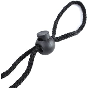A black rope and toggle, featuring a round plastic bead and braided cord design.