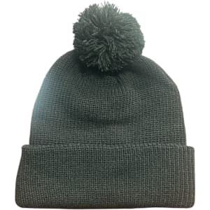 A dark grey knitted beanie featuring a pom pom on top and a folded cuff. It has a branding logo.