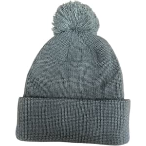 A grey knitted beanie with a pompom on top, featuring a folded cuff at the bottom and a logo.