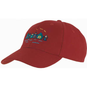 A red cap featuring an embroidered design of colourful houses and birds. It includes a logo on the side.