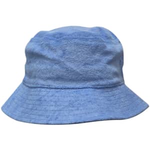 A light blue terry towelling bucket hat with a wide brim and a soft texture. It features a logo.