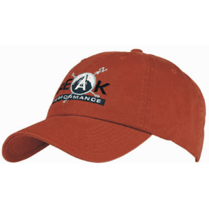 A washed chino twill cap in rust orange with an embroidered logo on the front.