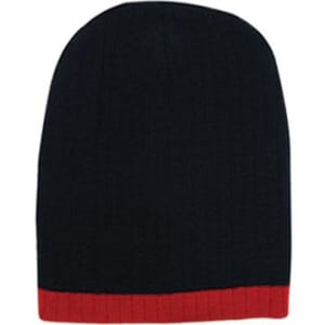 A two-tone cable knit beanie in navy blue with a red ribbed band at the base. It features a brand logo.