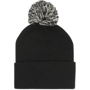 Acrylic beanie in black with a contrasting black and white pom pom on top. It features a rolled cuff.