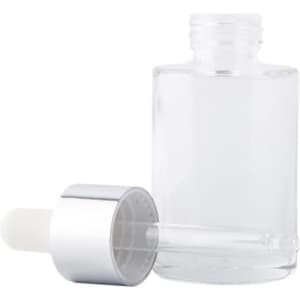 A clear glass dropper bottle with a silver cap, featuring a removable white dropper.