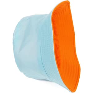 A solid reversible travel bucket hat in light blue with an orange interior. Features a logo on the side.