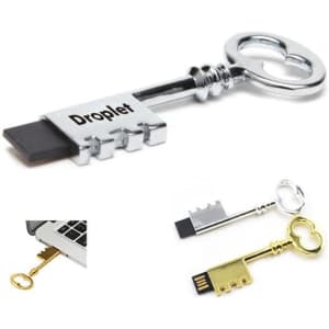 A key-shaped USB flash drive in silver and gold, featuring a logo and a sleek, metallic design.