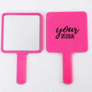 A square handle makeup mirror with a bright pink frame, featuring a blank side for custom designs.