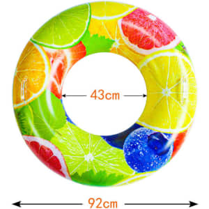 A large inflatable swimming ring with a colourful fruit design, featuring citrus fruits and vibrant colours, measuring 92 cm.