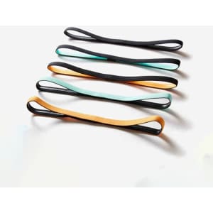 A set of custom silicone sports headbands in black with orange and mint accents, featuring a logo.