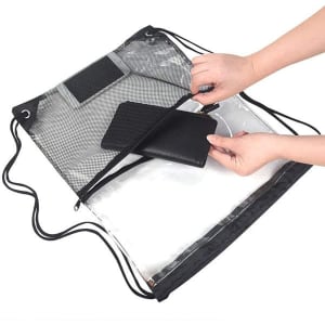 A clear drawstring bag with a black mesh pocket, being opened to reveal a black wallet inside.