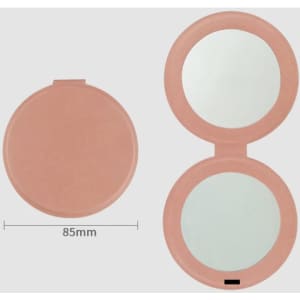 A pink PU mini pocket makeup mirror with two reflective surfaces, measuring 85mm in diameter.