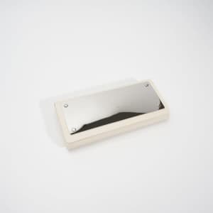 A spectacle case in cream colour with a reflective mirror surface on the top. It features a logo.