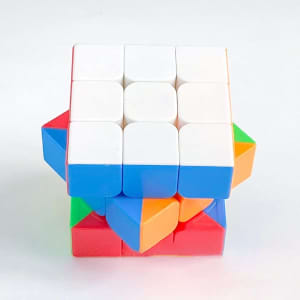 A 3x3x3 magnetic speed cube featuring white, blue, red, green, orange, and yellow colours, with a logo on one side.