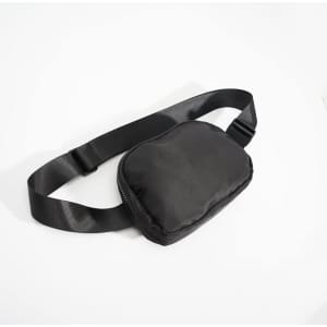 A black fanny pack with an adjustable strap and a zipper closure, featuring a simple design.