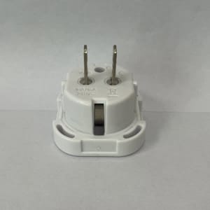 A white UK to USA plug adapter featuring two prongs and a round base. It includes a small logo on the side.