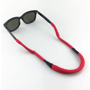 A red eyeglass string holder with black accents, featuring a pair of sunglasses attached.