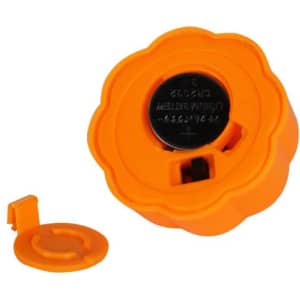 An orange pumpkin-shaped tea light holder with a removable base and a circular battery compartment.