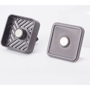 A car air freshener ventilation clip in grey, featuring a magnetic design with a textured and smooth side.