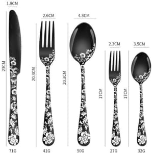 A stainless steel flatware set featuring black utensils with floral patterns, including a knife, fork, and spoons.