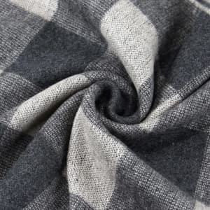 A custom winter scarf featuring a grey and black checkered pattern, made of soft, textured fabric.