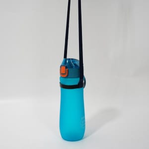 A drink bottle in vibrant blue with a teal lid and a black sling carrier attached.