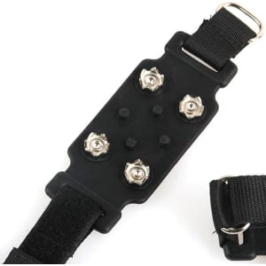 A pair of black heavy-duty anti-slip ice cleats with metal spikes attached to elastic straps for secure fitting.