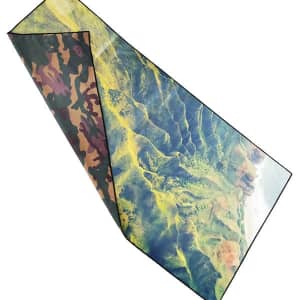 A custom microfiber beach towel featuring a vibrant, nature-inspired design with greens and browns, and a logo.