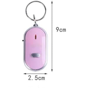 A portable key finder in pink with a keyring attachment, featuring a button and a small indicator light.