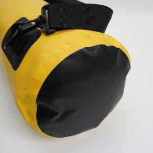 A yellow PVC waterproof dry bag with a black base and an adjustable strap. It features a logo.