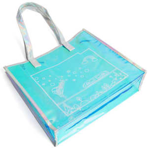 A transparent iridescent handbag in shades of blue with a whimsical design and two handles. It features branding.