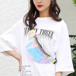 A woman wearing a holographic PVC waist bag with a black strap, styled casually in an oversized white T-shirt.