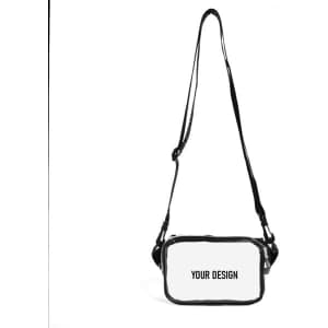 A clear PVC cross body bag with black trim and an adjustable strap. It features a blank area for custom designs.