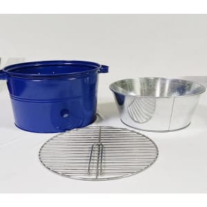 A blue portable barbecue bucket with a silver bowl and a round metal grill grate. The items are placed on a light background.