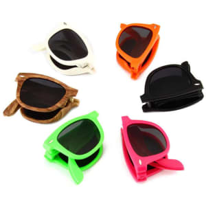 A set of foldable promotional sunglasses in white, orange, brown, pink, and green, featuring dark lenses and a logo.