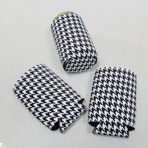 A drink bottle sleeve in a black and white houndstooth pattern, featuring three identical can cooler sleeves.