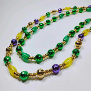 Light up LED bead necklaces featuring green, yellow, and purple beads interspersed with gold accents.