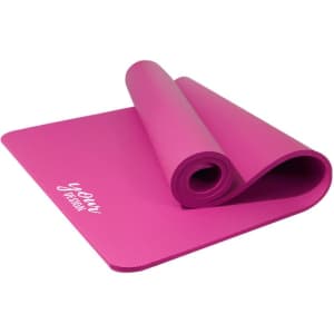 A pink yoga mat with a strap, rolled partially with a textured surface, featuring a logo.