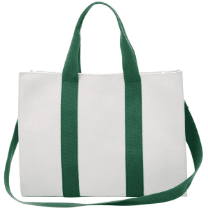 A vertical stripe canvas tote bag in white with green handles and a matching shoulder strap. It has a logo.