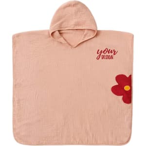 A baby hooded poncho towel in soft pink, featuring a floral design and a hood. It has a branding logo on it.