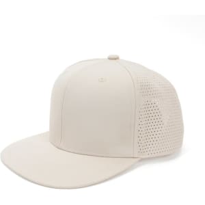 A beige embroidered sports snapback hat with a perforated mesh side, featuring a logo on the front.