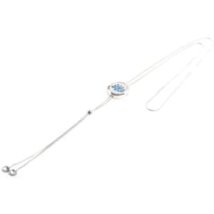 A stainless steel hollow aromatherapy pendant necklace with a silver chain and a decorative centrepiece.