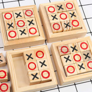 A wooden tic-tac-toe game featuring red and black symbols on square blocks within a natural wood frame.