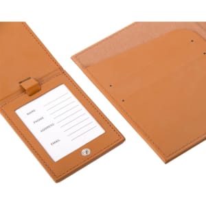 A tan PU leather luggage tag passport holder set featuring a slot for information and a soft interior lining.