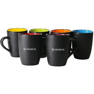 A set of black matte ceramic mugs with coloured interiors in red, green, blue, orange, and yellow. Each mug has a logo.